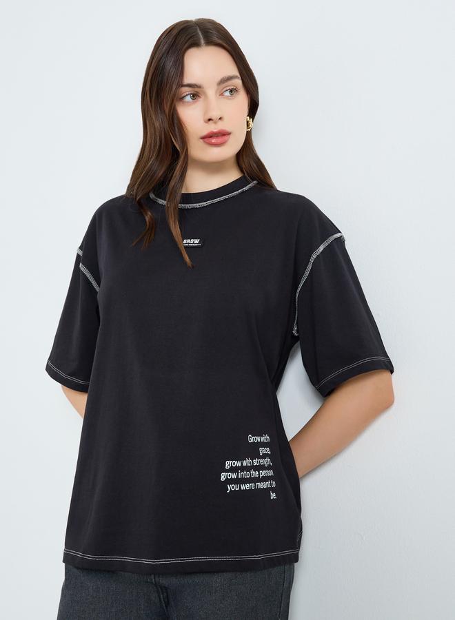 Styli Women Black Oversized Graphic Slogan T-Shirt - Image 1